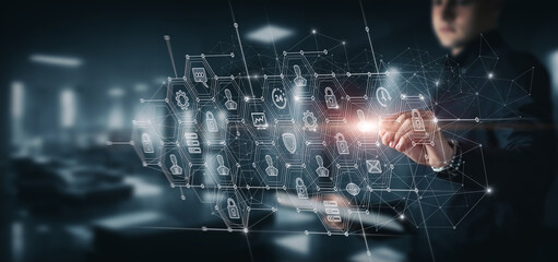 Businessman working on virtual screen of computer security system .