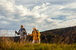 © Zoran Zeremski - Active senior couple with backpacks hiking together in nature on autumn day.