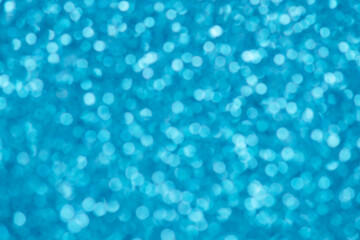 Blue bokeh background for christmas, defocused round lights and sunbeams, flare overlay
