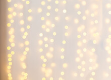 Classic Bokeh Background On White Background Walls. Defocus Image With Yellow Lights In Bokeh. Christmas Bokeh Background. Newyear Mood