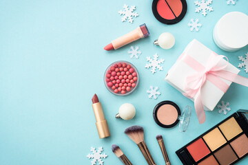 Fototapete - Winter cosmetic with holiday decorations on blue.