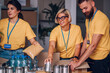 © Zamrznuti tonovi - Group of volunteers working in community charity donation center