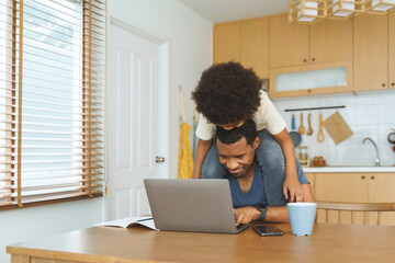 Wall Mural - African Father playing with his son