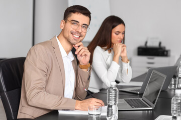 Poster - Young businessman having meeting in office