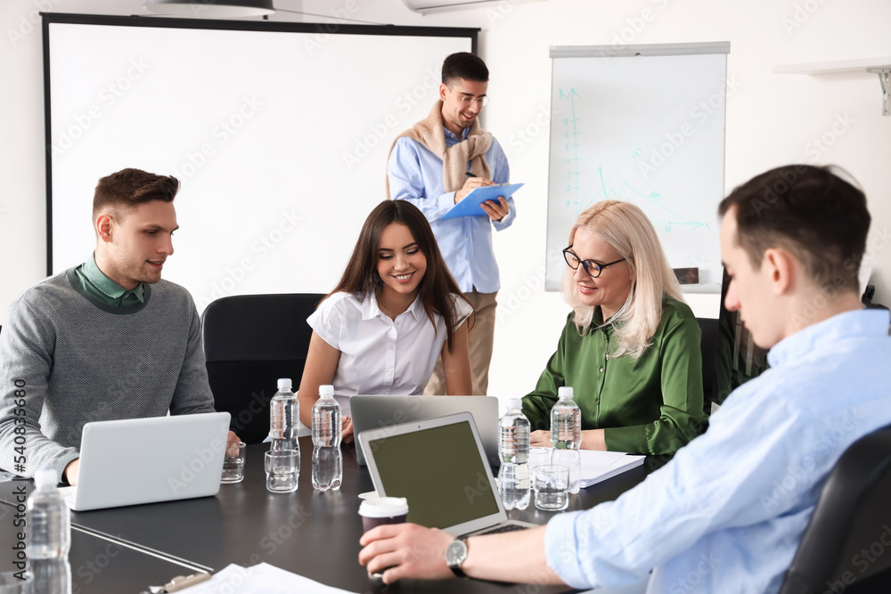 Business colleagues having meeting in office
