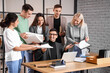 © Pixel-Shot - Co-workers having business meeting in office