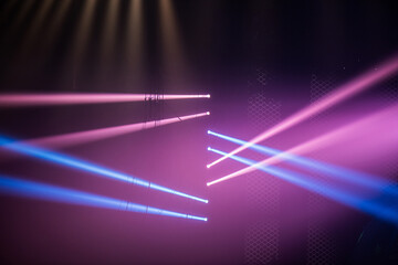 Wall Mural - colorful stage spotlights with laser radiation