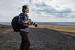 © Blue Jean Images - Male photographer looking at view
