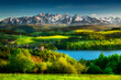 canvas print picture - View from the Pieniny on the Tatra Mountains, the Czorsztyn Lake and the Czorsztyn Castle, spring. Widok z pienin na tatry, jezioro czorsztyńskie i zamek w czorsztynie, wiosna. Przełęcz snozka. 
