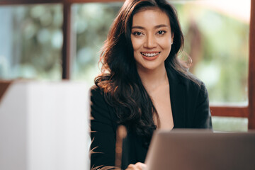 portrait of smile and happy young professional businesswoman, female freelance entrepreneur lifestyle with business work using computer laptop or tablet online cyberspace technology, beautiful woman