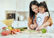 © J Maas/peopleimages.com - Happy, mother and child learning to cook with smile for help, guidance and support in the kitchen. Mama helping her little girl cut vegetables, food or meal for healthy diet and fun bonding at home