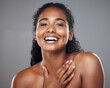 © Kirsten Davis/peopleimages.com - Skincare, beauty and portrait of a happy woman in a studio with a cosmetic makeup routine. Happiness, facial and natural face of a young model with a smile from Mexico isolated by a gray background.