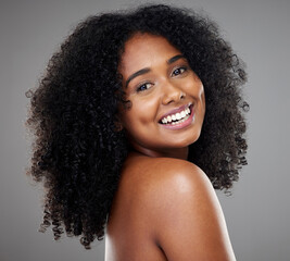 Wall Mural - Black woman afro, beauty and smile for skincare, cosmetics or treatment against grey studio background. Portrait of happy isolated African American female smiling with teeth in care for perfect skin