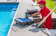 © Tomasz Zajda - Outdoor Pool Maintenance Service Worker