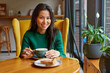 © olga pink - Portrait of young Asian woman drinking coffee witn apple pie in cafe