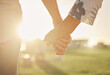 © Beaunitta V W/peopleimages.com - Retirement, couple and hands with sun closeup of married man and woman on field for summer walk. Support, care and trust of senior people in marriage walking in sunlight for romantic evening.