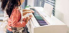 Asian Young Musician Girl Kid Having Fun Activities Play Piano Music Lesson In Music Education At Home