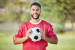 © Beaunitta V W/peopleimages.com - Sports man, soccer player and soccer field training with a soccer ball, happy and relax before fitness workout. Football, football player and sport portrait of excited player ready for game