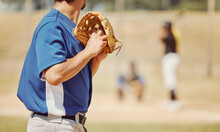 Baseball, Sports And Pitcher With A Ball And Glove To Throw Or Pitch At A Match Or Training. Fitness, Softball And Man Athlete Playing A Game Or Practicing Pitching With Equipment On Outdoor Field.