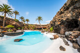 Fototapeta Desenie - Amazing cave, pool, natural auditorium, salty lake designed by Cesar Manrique in volcanic tunnel called Jameos del Agua in Lanzarote, Spain