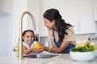 © Beaunitta V W/peopleimages.com - Vegetable, family and washing with a girl and mother cleaning a pepper in the kitchen of the home together for hygiene. Kids, health and cooking with a woman and daughter using a basin to rinse food