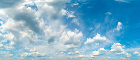 Wall Mural - Background with high blue sky and white clouds. Summer sky with cumulus clouds.