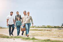Big Family, Happy And Walking For A Picnic On Holiday, Vacation Or Weekend Trip Outdoors For Relaxing And Bonding. Mother, Father And Grandma Travel With Old Man And Girl Child To Enjoy Quality Time