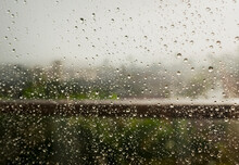 Close-up Of Wet Window During Rainy Season