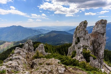 Poster - Rocky cliff overlooking the mountain landscape