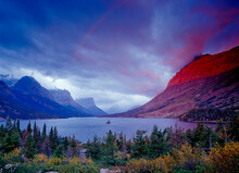 USA: Montana: Glacier National Park: A Stormy Sunrise Over Saint Mary Lake, Wild Goose Island, And Goat Mountain