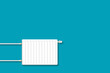 Heating battery, on a blue background. copy space. Heat saving. Energy crisis.