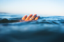 Hand In Ocean Water Surface Closeup