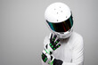 Professional Male Driver with Helmet and Gloves. Motorsport Racer with racing gear and equipment. Protective suit for motorsport