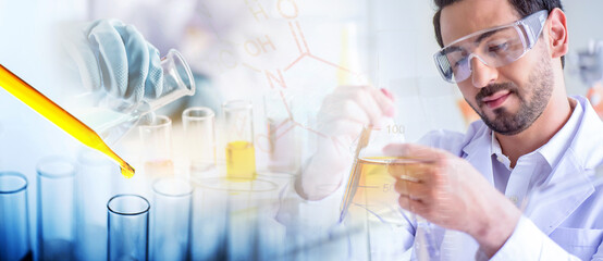 Wall Mural - attractive scientist man testing chemical sample in flask at laboratory with lab glassware backgroun