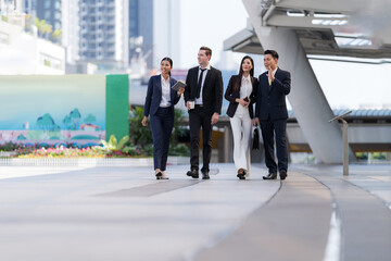 Wall Mural - Business people walking and talk to each other in front of modern office