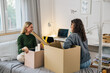 © cherryandbees - european friends sit on bed and talking in dorm