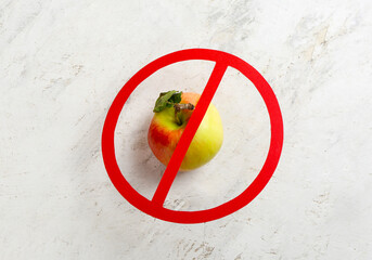 Wall Mural - Apple and stop sign on light background. Anorexia concept