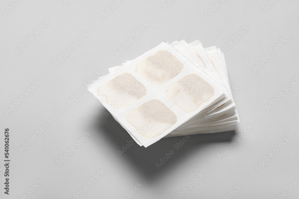 Mustard plasters on grey background