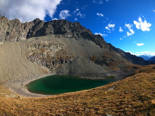 Mountain landscape of long distance hiking trail Tour Des Combins which crosses Switzerland to Italy via Bourg Saint Pierre, Fenetre Durand and Aosta Valley