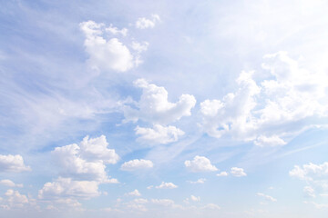beautiful light blue sky with many white cirrus and fluffy clouds in sunlight, background texture, h