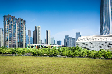 Canvas Print - Buildings and green parks in a modern big city