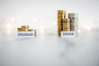 Saver vs spender texts in front of big and small stacks of coins. Concept  of money, abundance and wealth