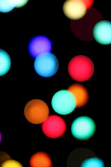 Canvas Print - colorful bokeh on a black background