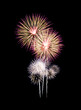 © boonsom - Fireworks on black background.