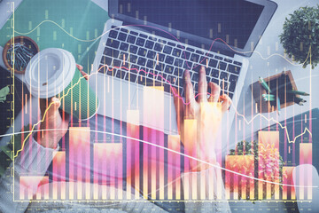 Double exposure of woman hands working on computer and forex chart hologram drawing. Top View. Financial analysis concept.