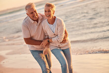 Couple, Retirement And Travel To The Beach, Hug And Love, Fun Together And Spending Quality Time Outdoor By The Ocean. Senior Man, Woman And Happy, Smile On Adventure And Out In Nature At Sea.