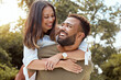 © J Maas/peopleimages.com - Couple, piggy back and outdoor love hug of black people with happiness and care outdoor. Happy, gratitude and smile of a girlfriend and boyfriend bonding and spending quality time in a nature park