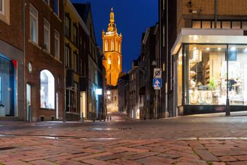 Shopping street in Roermond with view to the cathedral at night, Netherlands