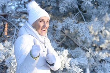 Sticker - Old woman in a fur coat in the winter 