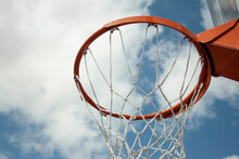 Basketball Hoop With Its Net Under A Blue Sky